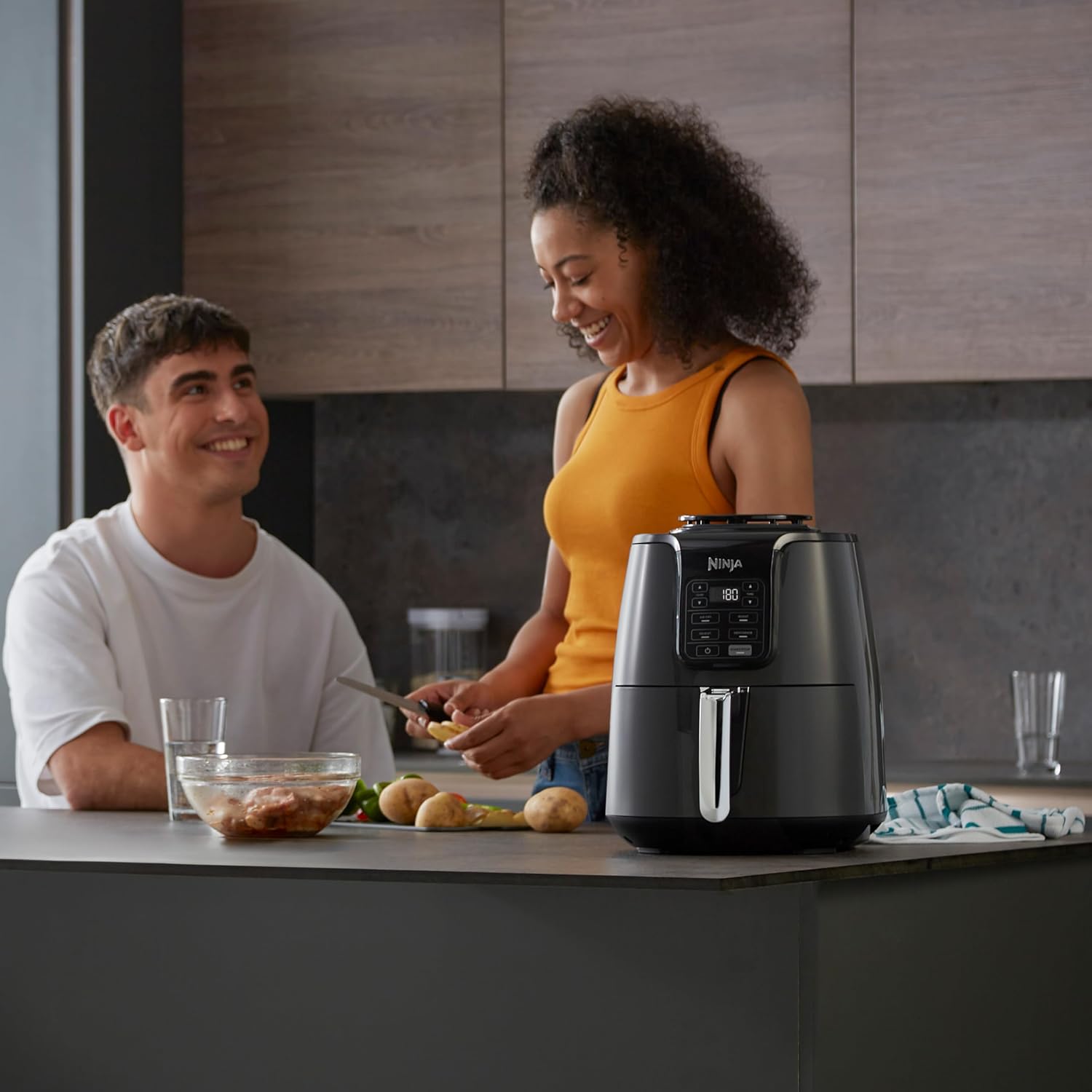 Ninja Air Fryer, 3.8L, 4-in-1, Uses No Oil, Air Fry, Roast, Reheat, Dehydrate, Non-Stick, Dishwasher Safe Basket, Cooks 2-4 Portions, Digital, Grey & Black, AF100UK